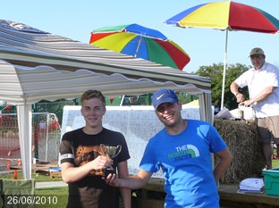 Ben receives winners cup from Rob
